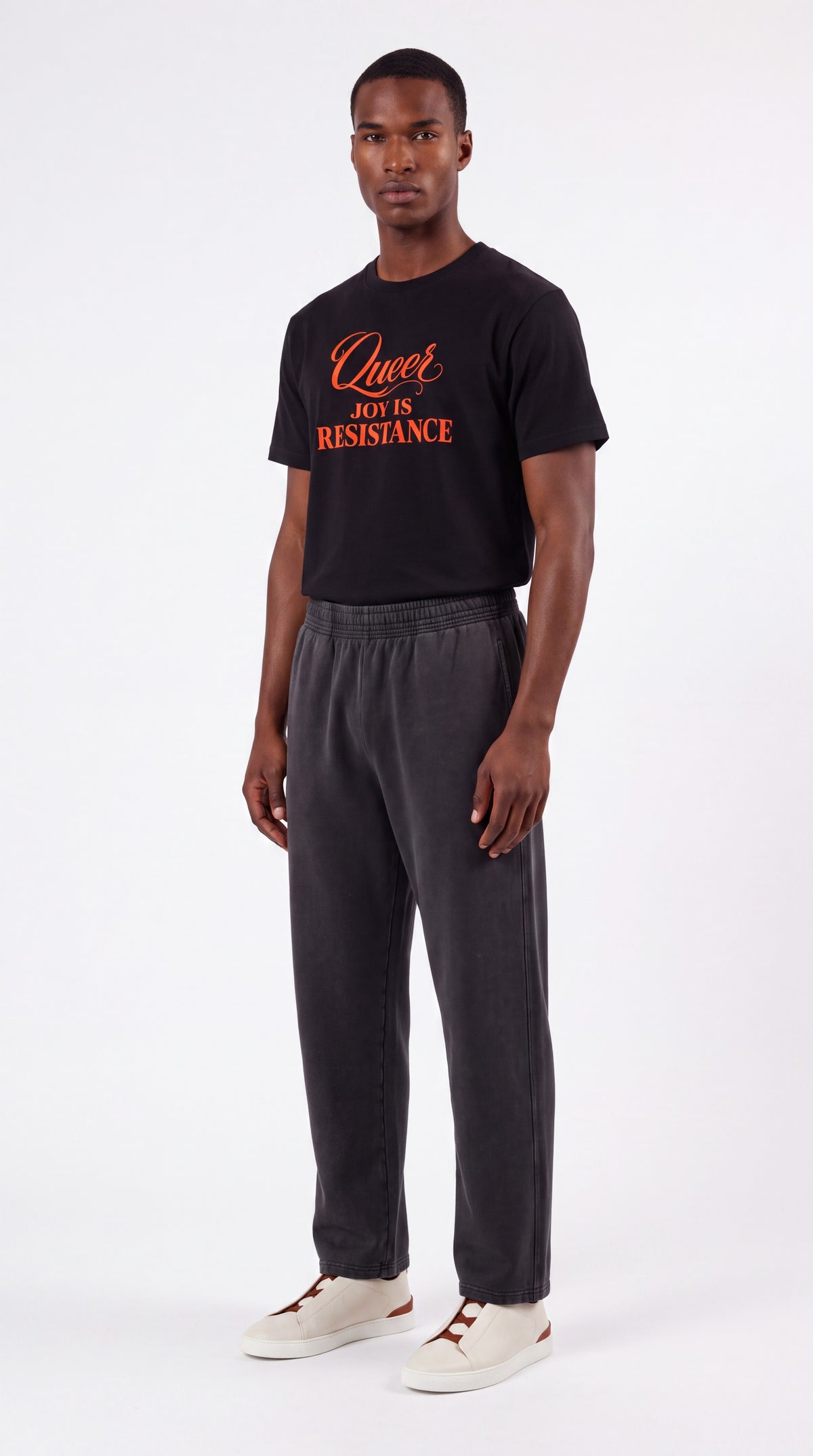 Unisex Seamless 100% Cotton Tee | QUEER JOY IS RESISTANCE Red Logo